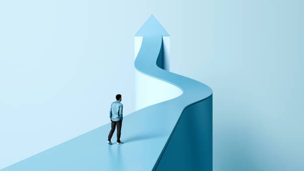 A man walking on a winding path leading to an upward arrow, symbolizing the journey of self-awareness, mindfulness, and personal growth.