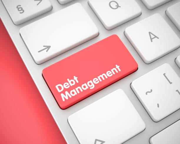 A close-up of a keyboard with a red "Debt Management" key, symbolizing financial planning and debt control.