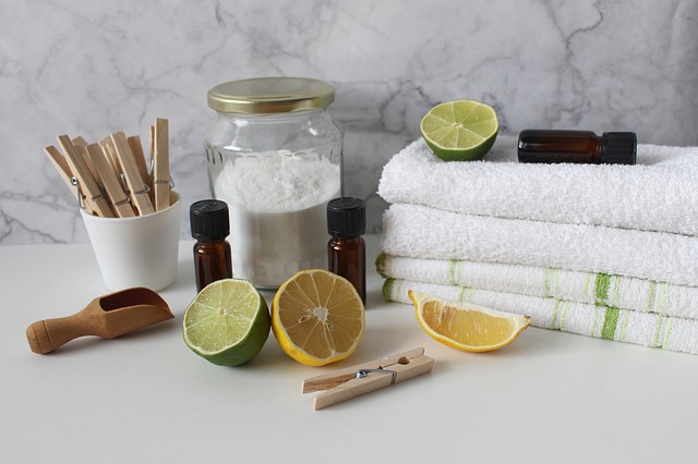 Natural skin care ingredients including lemon, essential oils, and towels for an organic beauty routine.