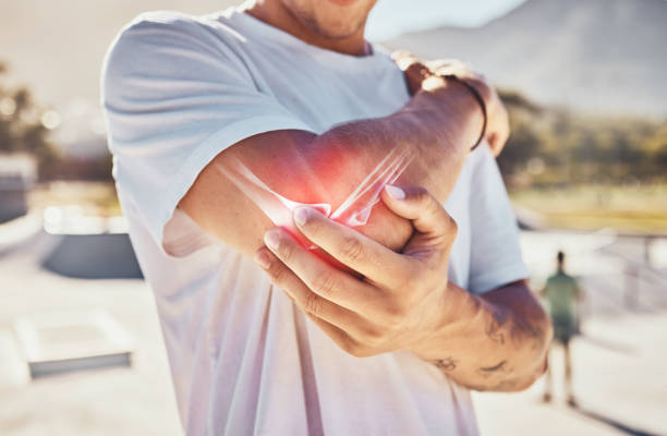 A person holding their elbow with highlighted pain, illustrating the importance of keeping your joints healthy and preventing discomfort with proper care.