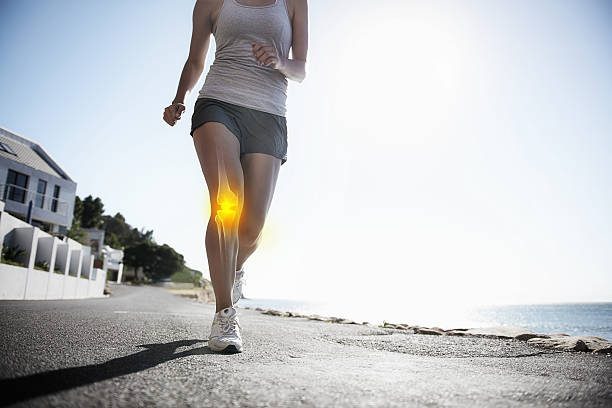 A person jogging outdoors with knee pain highlighted, emphasizing the importance of keeping joints healthy through exercise and proper care.